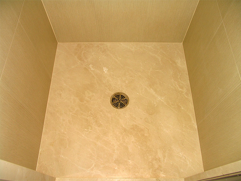 shower stall with marble floor
